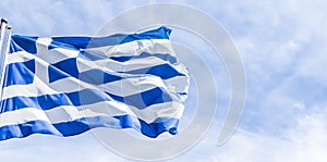 Greek flag and cloudy sky in summer day, politics of Europe