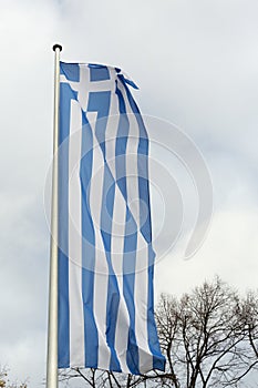 Greek flag on the metal pole