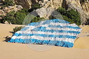 Greek flag painted on rock, tsambika beach