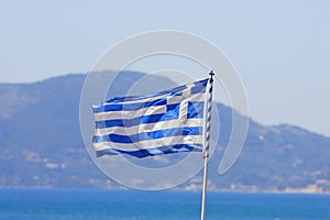 Greek flag by the sea