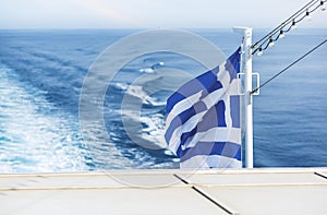 Greek flag. Travelling by ferry among Cyclades islands, Greece