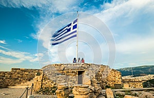 Greek flag waving against blue sky