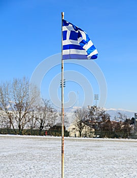 Greek flag waving in the blue sky