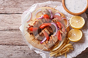 Greek food: Souvlaki with vegetables and pita bread. horizontal