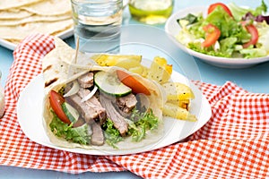 Greek gyros with pork, vegetables and homemade pita bread