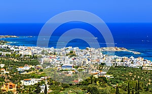 Greek holidays - beautifulcity of Hersonissos, view from the top of mountain with turquoise sea. Crete island photo