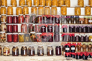 Greek homemade jam and canned food on the shelves of local shops