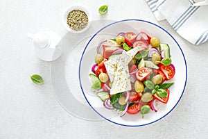 Greek or horiatiki salad with fresh vegetables and feta cheese, dressed with olive oil, traditional Greek cuisine salad