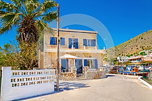 Greek house with blue wooden windows, Greece