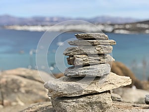 GREEK ISLAND LIFE â€” A pile of stones over the hills and cliffs of Paros, Greece