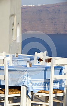 Greek island restaurant furniture view caldera photo