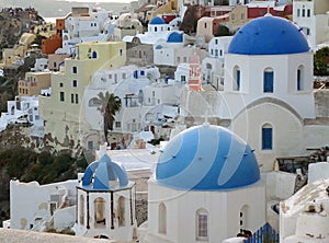 Greek Islands traditional white and blue churches and architecture at Oia village, Santorini island