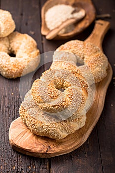 Greek koulouri or Turkish bagels called Simit in stack. Traditional street food, crispy sesame bread ring bagels