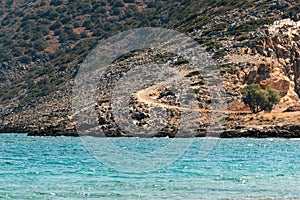 Greek landscape - rocky mountain and Aegean sea.