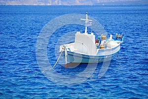 Greek landscape with a white fishing boat