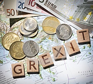 Greek map, euros and drachma grexit letters from above