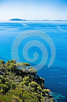 Greek mediterranean coast with beautiful blue tones of Aegean sea in Sithonia