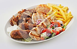 Greek mixed grill platter with salad and chips