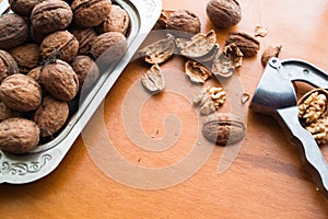 Greek nuts whole and split and the Nutcracker on wood