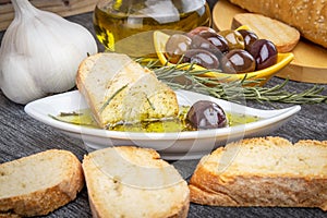 Greek olive oil bread dip. Bread with Oil for Dipping with Herbs & Spices. Close up Olive oil sauce