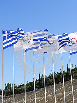 Greek and Olympic flags flying at the Panathenaic Stadium, Athens, Greece