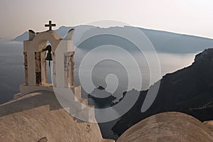 A greek orthodox church in Oia with sea background, Santorini