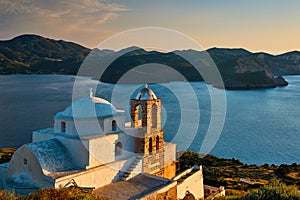 Greek Orthodox church in Plaka village on Milos island on sunset in Greece