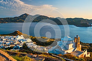 Greek Orthodox church in Plaka village on Milos island on sunset in Greece