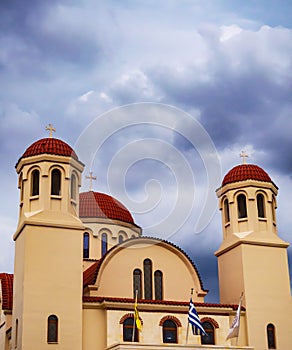 Greek Orthodox church with storm clouds gathering over it