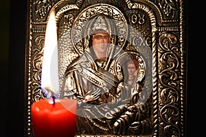 Greek orthodox icon with candle