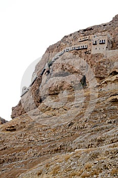 Greek Orthodox monastery in mountain of temptation. Pilgrimage to the Holy Land, vertical photo