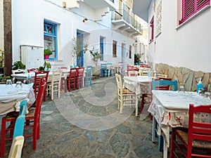 Greek outdoors tavern restaurant at Batsi village, Andros island Cyclades Greece