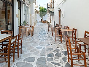 Greek outdoors traditional tavern restaurant at Tinos island, Chora town, Cyclades Greece