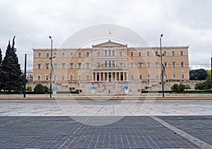 The Greek parliament building on constitution square under cloudy sky