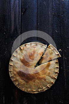 Greek Pie Spanakopita with Spinach and Cheese, top view, copy space.