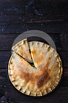 Greek Pie Spanakopita with Spinach and Cheese, top view, copy space.