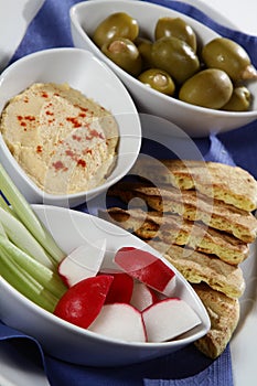 Greek platter with olives vegetables and toast