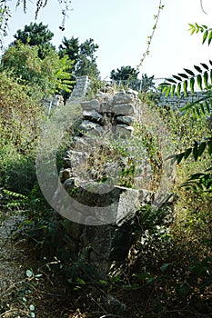 Greek-Roman  ancient ruins, abandoned places. Rock stone wall.