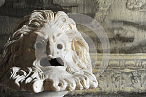 Greek or roman stlye theater mask sculpture photo