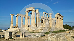 Greek ruins at the Temple of Aphaia on island of Egina ancient roman columns golden hour historic remains Greece Mediterranean sea