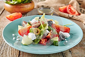 Greek Salad in Blue Plate or Horiatiki Salad photo