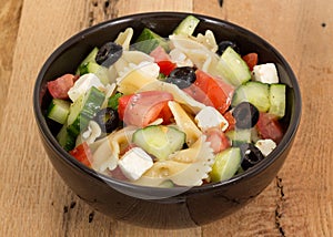 Greek salad bowl with pasta