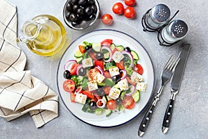 Greek salad with feta cheese and black olives on plate