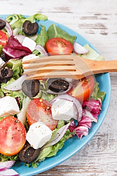 Greek salad with feta cheese and vegetables. Healthy lifestyles, food and nutrition