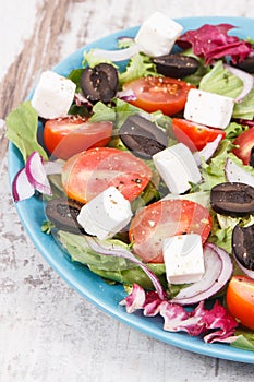 Greek salad with feta cheese and vegetables. Healthy lifestyles, food and nutrition