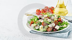 Greek Salad with feta and tomatoes, dieting food on white background copy space closeup long banner