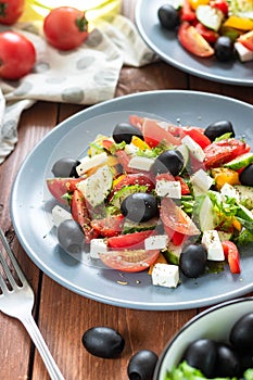 Greek salad with fresh tomatoes, peppers and cucumbers