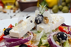 Greek salad with fresh vegetables, feta cheese and black olives