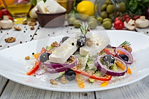 Greek salad with fresh vegetables, feta cheese and black olives