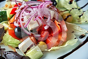 Greek salad with fresh vegetables, feta cheese and black olives